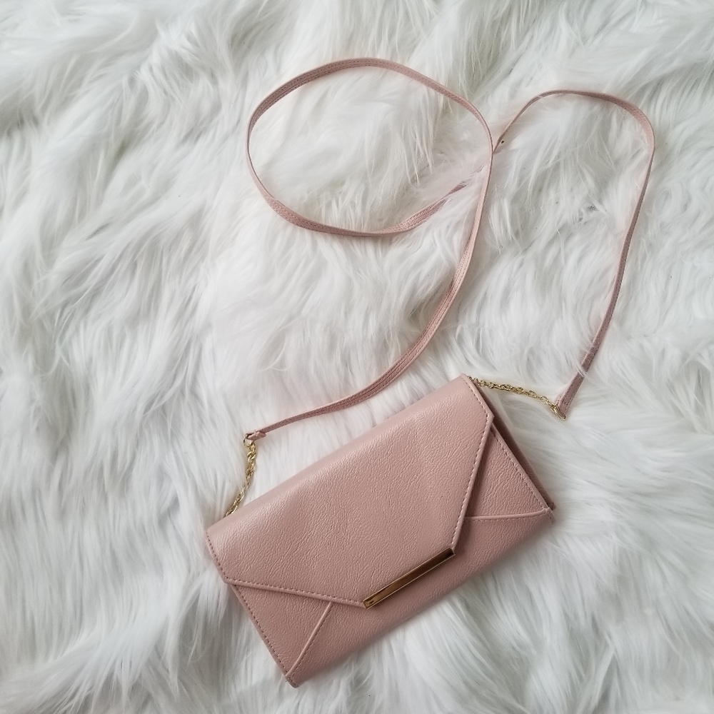 Pink cross body clutch